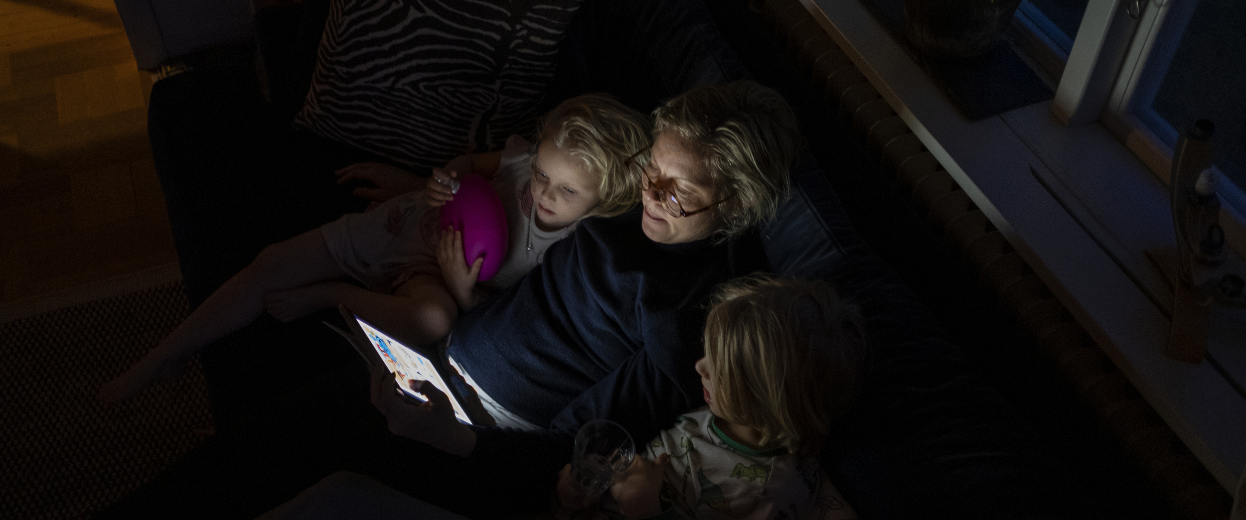Adult woman is reading for children