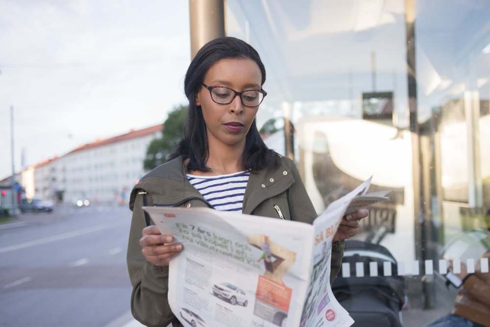 Woman reading a newspaper 
