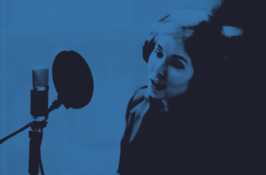 Blue image, reporter talking into a microphone