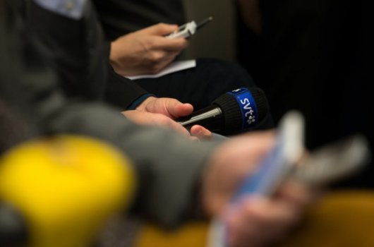 A microphone with the Swedish public broadcaster's logo.