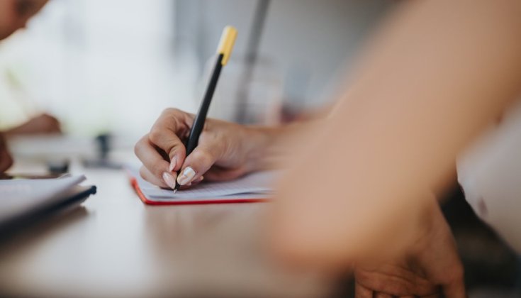 hand writing in a note book 